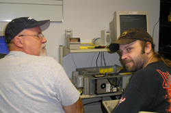 Two technicians looking at a computer